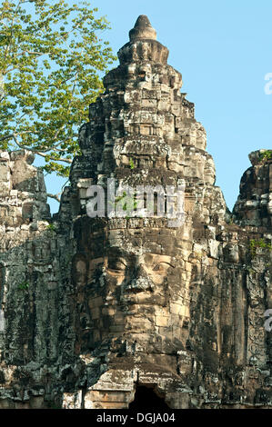 Sandstone Gopura, south gate of Angkor Thom, with four faces looking in the four cardinal directions, Angkor Thom, built by King Stock Photo