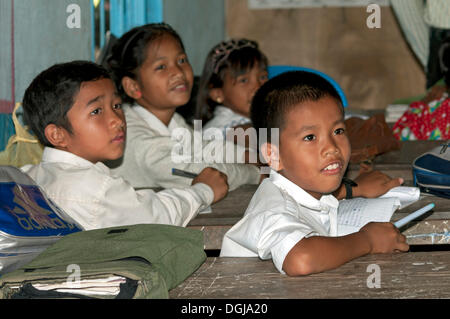 Elementary students wearing school uniforms in a school of Areyskat, a suburb of Phnom Penh, Cambodia, Southeast Asia Stock Photo