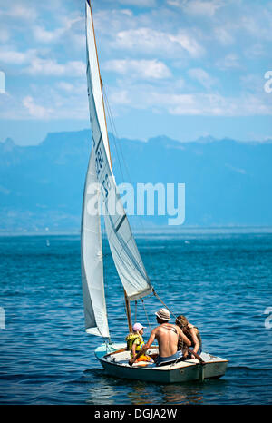 Family trip on a sail boat on Lake Geneva near Morges, Vaud Alps at back, Alpes vaudoises, Canton of Vaud, Switzerland, Europe Stock Photo