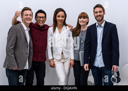 Portrait of creative team celebrating success Stock Photo