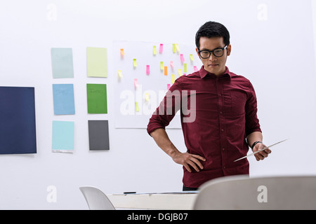 Young male preparing work in design studio Stock Photo