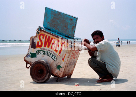 ice cream seller waiting for customers on benaulim beach goa india Stock Photo