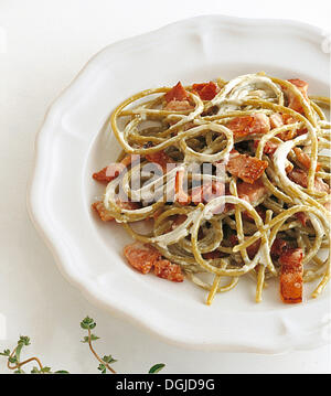 Green spaghetti with classic carborara cause, Italy. Stock Photo