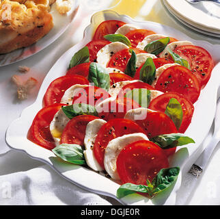 Insalada caprese, mozzarella with tomatoes, basil and the finest olive oil, Italy. Stock Photo