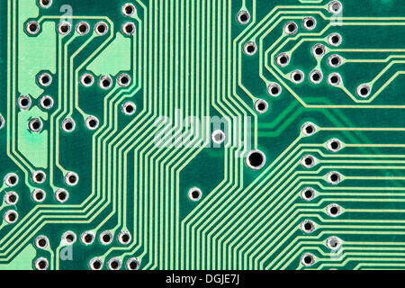 Green printed circuit board with conductor tracks Stock Photo