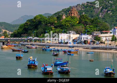 Fishing boats, Port of Nha Trang on the Cai river, in the back the Po Nagar temple, Vietnam, Southeast Asia Stock Photo