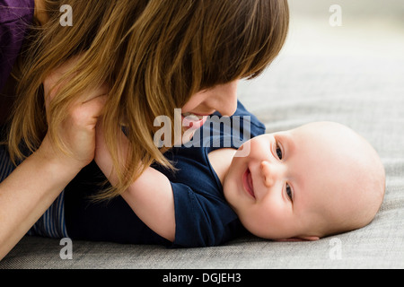 Mother and baby son face to face Stock Photo