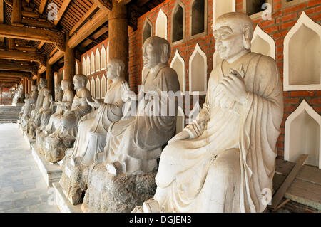 Alabaster statues inside the Chua Bai Dinh pagoda, currently a construction site, to become one of the largest pagodas of Stock Photo