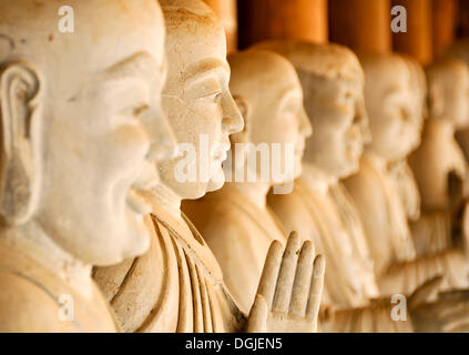Alabaster statues inside the Chua Bai Dinh pagoda, currently a construction site, to become one of the largest pagodas of Stock Photo