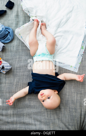 Baby boy wearing nappy, overhead view Stock Photo