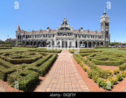 Garden in front of the historic Dunedin Railway Station, Dunedin, South Island, New Zealand, Oceania Stock Photo