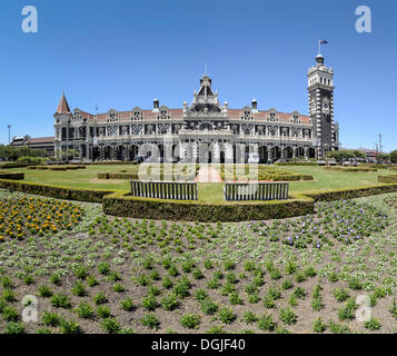 Garden in front of the historic Dunedin Railway Station, Dunedin, South Island, New Zealand, Oceania Stock Photo