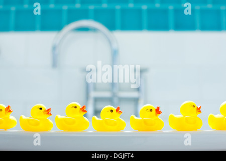Row of three yellow rubber ducks for bathtime Stock Photo
