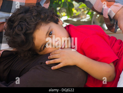 Kid Resting On His Father Leg, Erbil, Kurdistan, Iraq Stock Photo