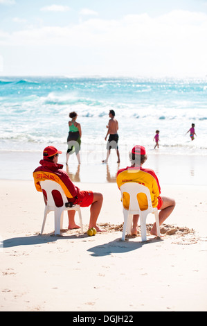Two lifeguards on duty on Cylinder Beach on North Stradbroke Island in Queensland. Stock Photo