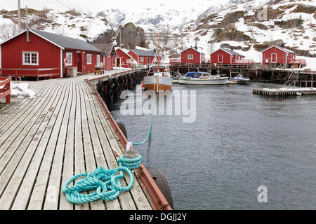 Small harbour with red fishermen's huts in winter, A, Lofoten, Nordland, Northern Norway, Norway Stock Photo