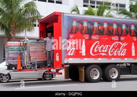 Miami Beach Florida,Collins Avenue,Coca-Cola,delivery,tractor trailer truck,lorry,Black man men male,driver,job,working,work,tail lift,looking FL13073 Stock Photo