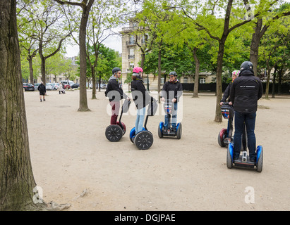 A Segway tour group in the Parc du Champ de Mars, Paris, France Stock Photo
