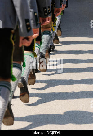 Trachtler wearing traditional costume marching in step, detail of legs, Loisachgau Trachtenfest folklore festival, Neufahrn Stock Photo