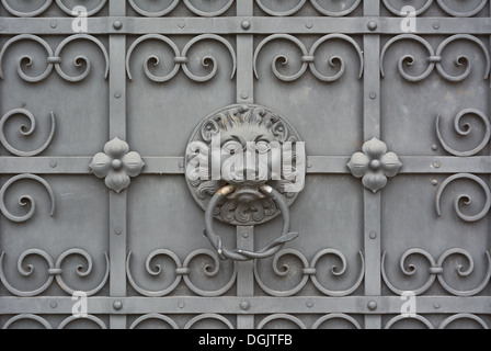 Lion Face on Wrought Iron Door at the Bavarian National Museum in Munich Stock Photo