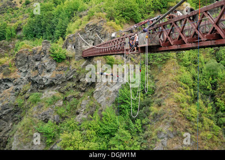 Bungee jumping from the historic suspension bridge over the Kawarau River, Arrowtown, South Island, New Zealand Stock Photo