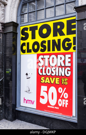 A store closing sign in the window of an HMV store in London. Stock Photo