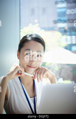 a woman working with a laptop