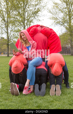 Group of young people performing in city park Stock Photo