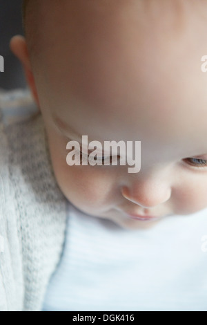 Portrait of baby boy looking down Stock Photo