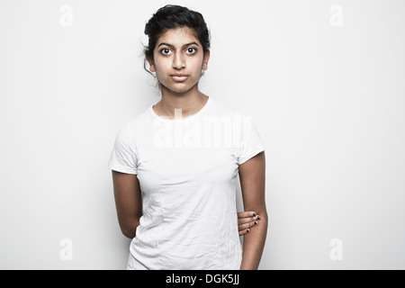Portrait of young woman wearing white top garment Stock Photo