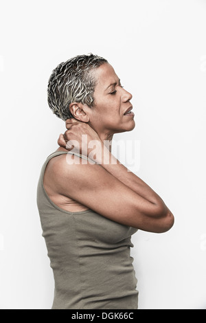 Senior woman with neck pain Stock Photo