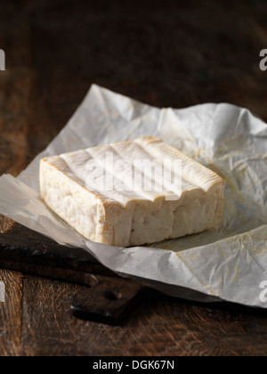 Still life with whole pont l'eveque cheese Stock Photo