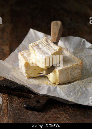 Still life with slice of pont l'eveque cheese Stock Photo