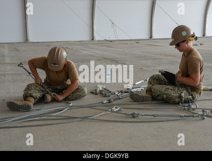 NAVAL SUPPORT ACTIVITY BAHRAIN (Oct. 15, 2013) Utilitiesman 3rd Class Charity Hughes, left, and Steelworker Constructionman Ama Stock Photo