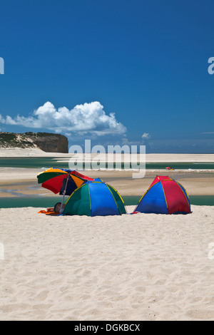 Colourful tents on beach at Obidos Lagoon on the Silver Coast.