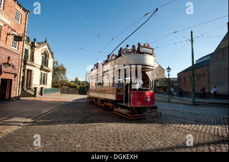 Vintage tram with passengers in open air museum. Stock Photo