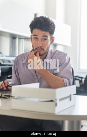 Portrait of businessman at work in office Stock Photo