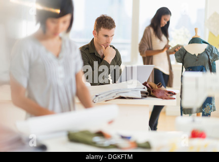 People working in fashion studio Stock Photo