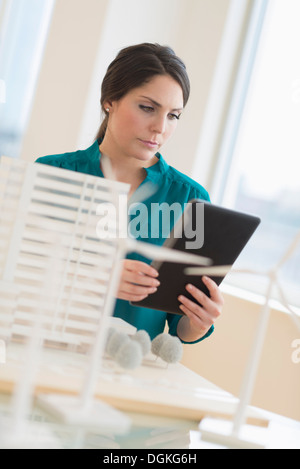 Female architect working in office Stock Photo