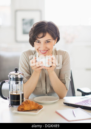 Woman taking a coffee break Stock Photo - Alamy