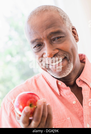 African Man Holding Apple Fruit Nutrition Concept Stock Photo - Alamy