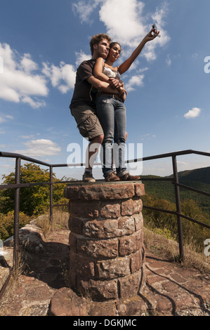 Elk213-1600v France, Alsace, Vosges Regional Park, Falkenstein Chateau ruins, with young couple taking selfie Stock Photo