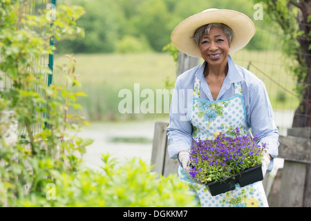 USA, New Jersey, Old Wick, Portrait of senior woman working in garden Stock Photo