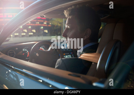 Businessman driving car Stock Photo