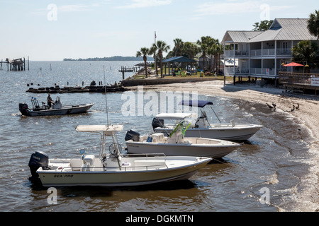 Power fishing boats with canopies anchored beached in Cedar Key along the Gulf coast of Florida. Stock Photo