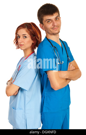 Young team of doctors standing back to back with arms folded isolated on white background Stock Photo