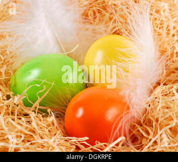 Three Easter eggs in an Easter basket Stock Photo