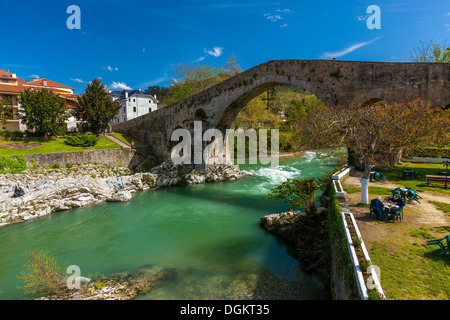 A view through the archway of a Roman bridge over the Sella River in Cangas De Onis. Stock Photo