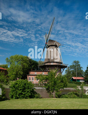 A Dutch three-storey windmill with a gallery, landmark of Hinte, East Frisia, Lower Saxony Stock Photo
