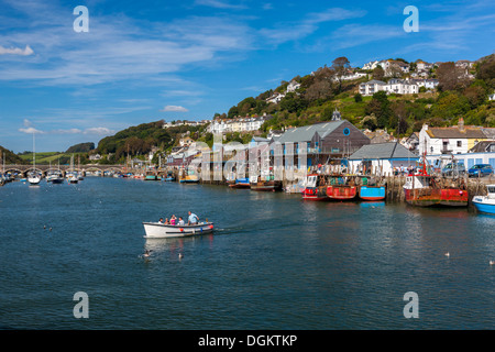 Small ferry carrying passengers across the River Looe. Stock Photo